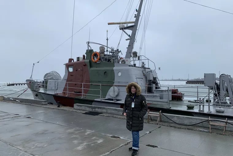 Worldview columnist Trudy Rubin in front of Ukrainian Coast Guard patrol boat in port of Berdyansk.