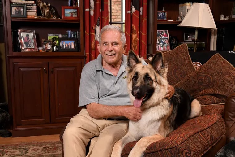 Gerald B. Shreiber, board chairman of the Pennsauken-based J&J Snack Foods Corp, sits with his dog Hachi at his home in Mullica Hill, N.J.