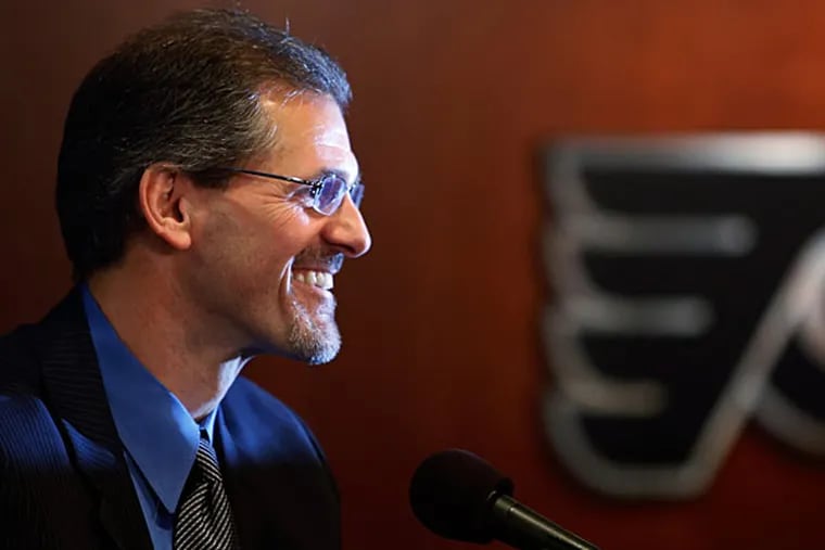 Ron Hextall smiles during an NHL hockey news conference, Wednesday, May 7, 2014, in Philadelphia. (Matt Slocum/AP)