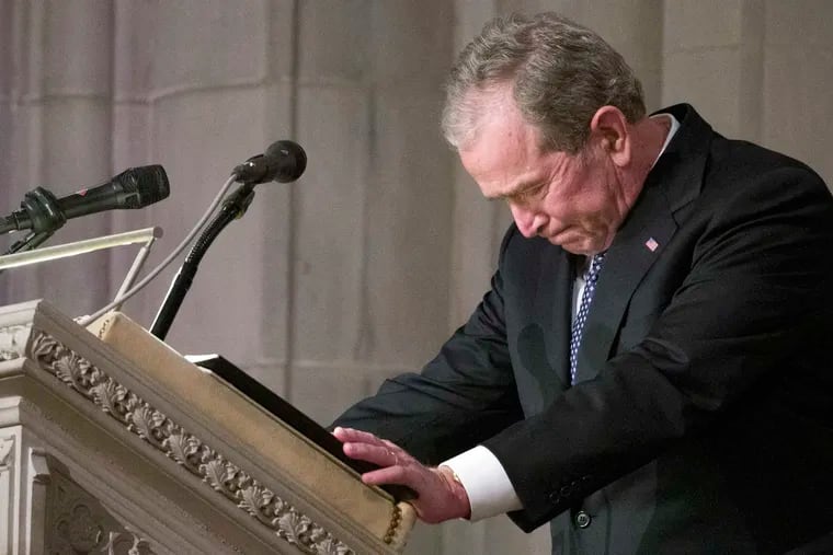 Former President George W. Bush becomes emotional as he speaks at the State Funeral for his father, former President George H.W. Bush at the National Cathedral Wednesday in Washington.