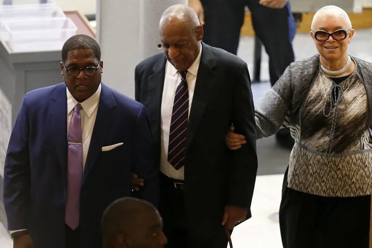 Andrew Wyatt, left, Bill Cosby, center, and his wife, Camille Cosby, right, enter the Montgomery County Courthouse earlier this week.