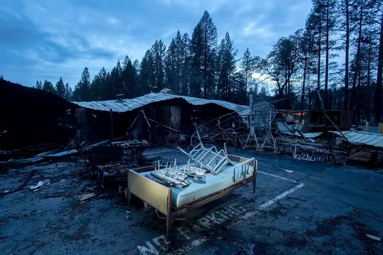 A bed rests outside Cypress Meadows Post-Acute, a nursing home leveled by the Camp Fire, on Tuesday, Dec. 4, 2018, in Paradise, Calif. (AP Photo/Noah Berger)