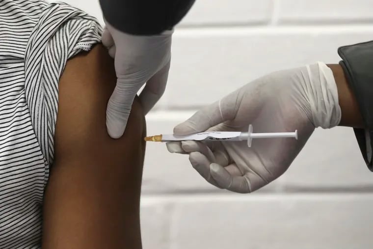 A vaccine volunteer receives an injection at the Chris Hani Baragwanath hospital in Soweto, Johannesburg.