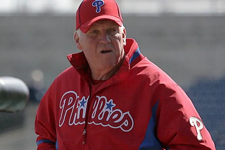 Phillies' Manager Charlie Manuel stands near the batting cage before a game at Bright House Field. (Yong Kim / Staff Photographer)