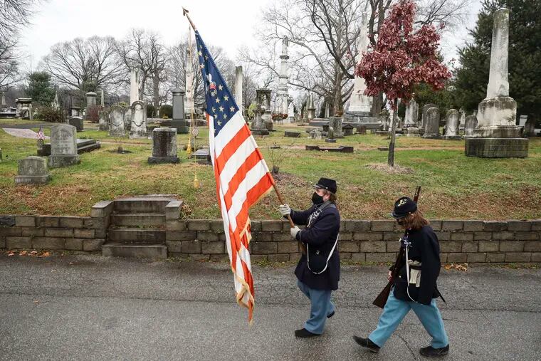 Bill Massinger and his son Ander Massinger, 15, of Hatboro, and the Sons of Union Veterans of the Civil War, Baker-Fisher Camp No. 101, march towards General George G. Meade's grave during a celebration of his birthday at the Laurel Hill Cemetery in Philadelphia, Pa. on Thursday. The General Meade Society of Philadelphia has been celebrating the General's birthday at his gravesite since 1995. This year the festivities were pared down due to the coronavirus pandemic.