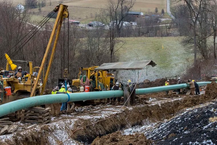 Workers install the Mariner East 2 pipeline in Pennsylvania in 2018. The PennEast Pipeline, which would connect Pennsylvania and New Jersey, is subject of a legal dispute that was argued Wednesday before the U.S. Supreme Court.