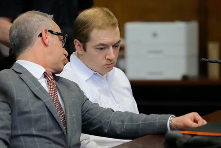 James Jackson (right) confers with his lawyer during a hearing in criminal court, Wednesday Jan. 23, 2019 in New York. Jackson, a white supremacist, pleaded guilty Wednesday to killing a black man with a sword as part of a racist plot that prosecutors described as a hate crime. He faces life in prison when he is sentenced on Feb. 13.