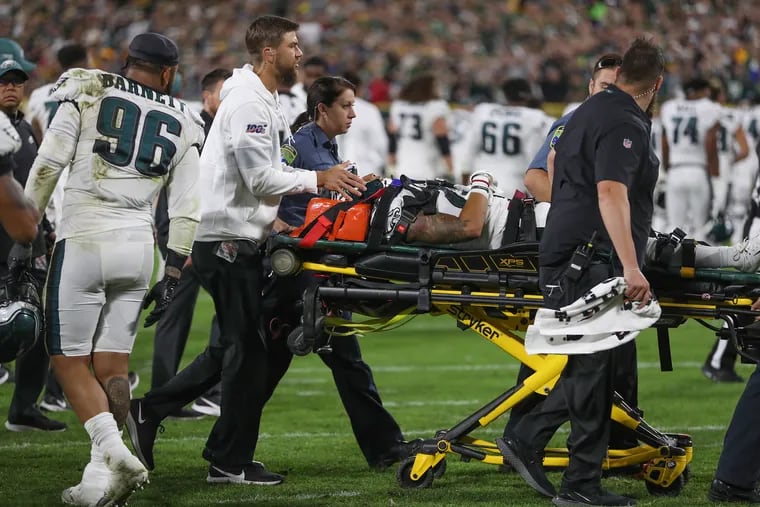 Medical personel wheel Eagles Avonte Maddox off the field after he sustained an injury against the Packers.