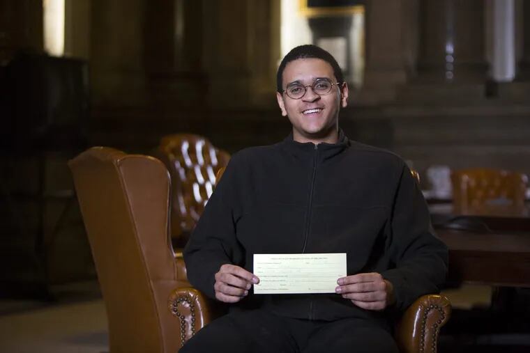 Saul Threadgill, a High School for Creative and Performing Arts (CAPA) holding the ticket he received after submitting his petitions to run to be a Democratic City Committee person. He was accompanied by his civics teacher, Grace Palladino, and his campaign mangers. Center City, Philadelphia, March 6th, 2018.