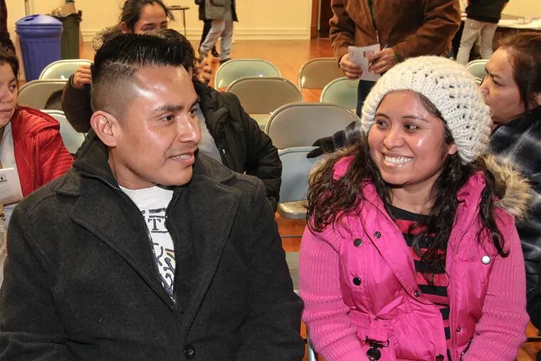 Pedro Lopez, 36 and Beatriz Balbuena, 33 have a child together and attend the informational meeting in Phoenixville, PA.