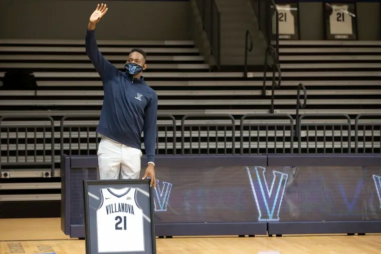 Dhamir Cosby-Rountree of Villanova stands separate from his teammates during the Senior Night celebration before their game against Creighton on March 3, 2021 at the Finneran Pavilion at Villanova University. Because of leg surgery Cosby-Roundtree is outside the team’s COVID  bubble.