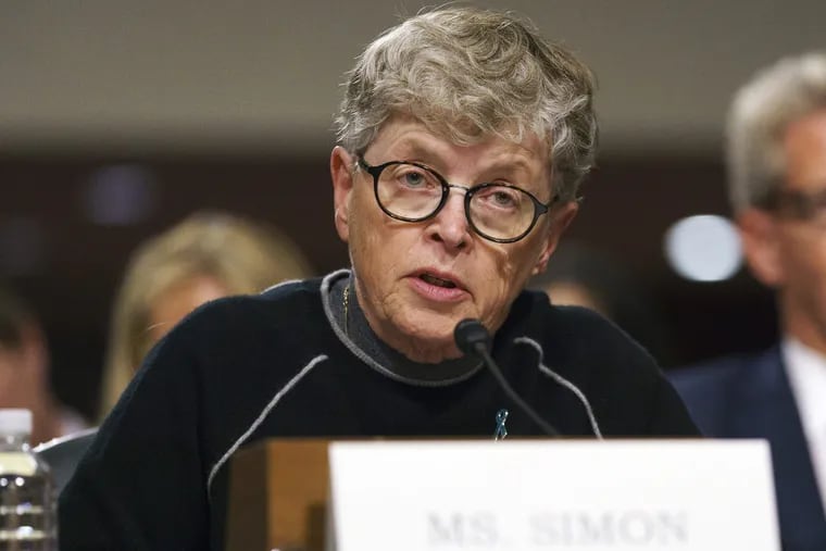 In this June 5, 2018 file photo, former Michigan State President Lou Anna Simon testifies before a Senate subcommittee in Washington. Simon has been charged with lying to police conducting an investigation of Larry Nassar's sexual abuse. Simon, who stepped down earlier this year over the scandal, was charged Tuesday, Nov. 20, 2018, with two felonies and two misdemeanors.