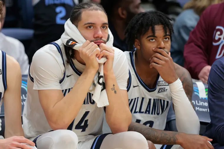 Villanova's Lance Ware (left) and Hakim Hart watch from the bench late in the loss to Marquette on Tuesday. The Wildcats have lost five straight regular-season games for the first time since 2008.