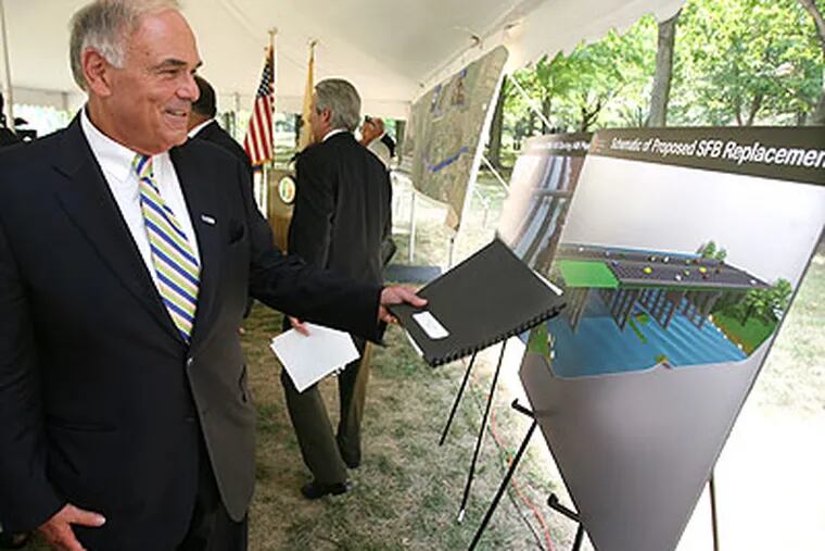 Pennsylvania Gov. Edward Rendell looks over a schematic of the proposed changes to the Scudder falls Bridge on I-95.(Charles Fox / Staff Photographer)
