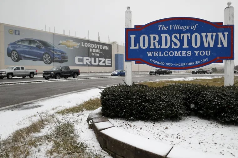 A banner depicting the Chevrolet Cruze model vehicle is displayed at the General Motors' Lordstown plant. Even though unemployment is low, the economy is growing and U.S. auto sales are near historic highs, GM is cutting thousands of jobs in a major restructuring aimed at generating cash to spend on innovation. GM put five plants up for possible closure, including the plant in Lordstown.