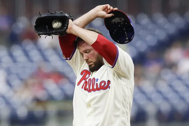Phillies pitcher Tommy Hunter wipes his face after giving up two runs to the Milwaukee Brewers in the ninth-inning on Saturday, June 9, 2018 in Philadelphia. YONG KIM / Staff Photographer