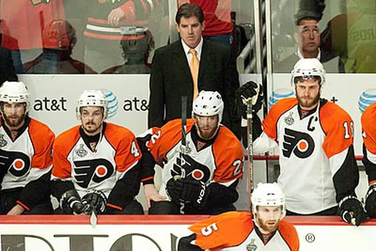 Peter Laviolette had plenty of work to do on the Flyers' day off. (Ed Hille/Staff Photographer)