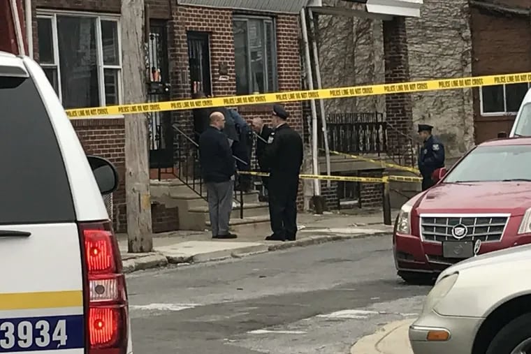 Philadelphia police gathered around the 2900 block of Judson Street in North Philadelphia where an officer was shot in the left shin on Friday, Dec. 8.