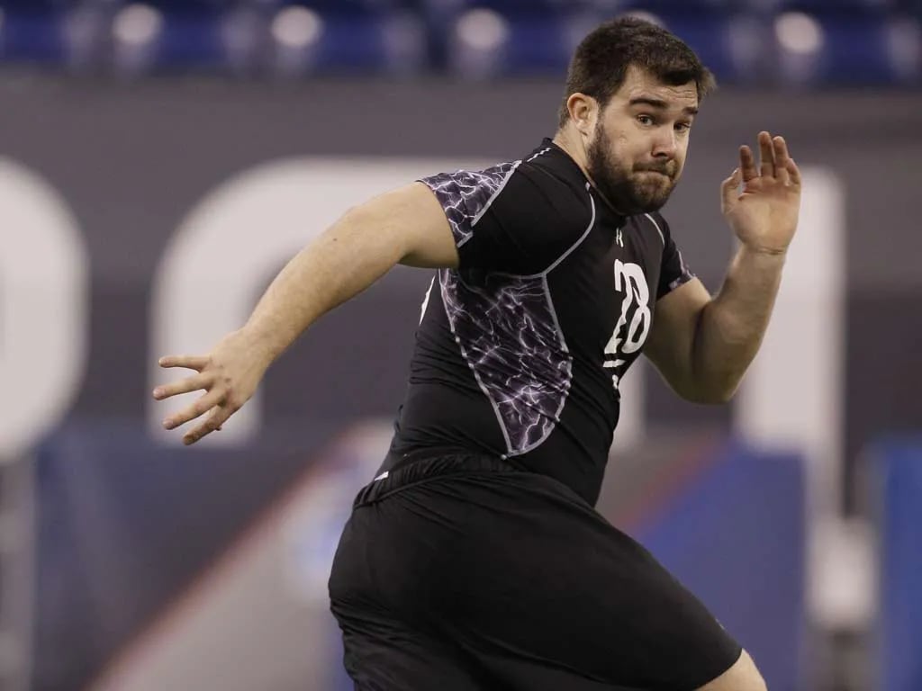 Cincinnati offensive lineman Jason Kelce, who became a sixth-round success story for the Eagles, runs a drill at the 2011 combine. (AP Photo/Darron Cummings)