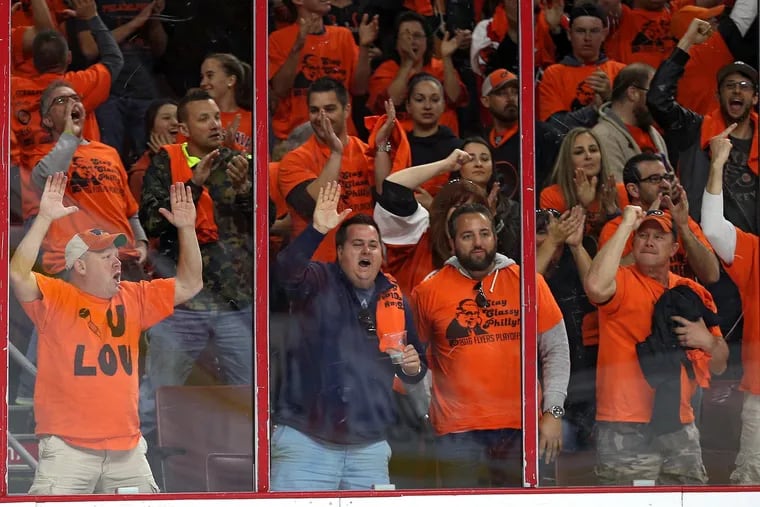 Fans cheer as the Philadelphia Flyers play the Washington Capitals during the first period in Game 6 of the Eastern Conference quarterfinals at Wells Fargo Center on April 24, 2016, in Philadelphia. (Patrick Smith/Getty Images/TNS)