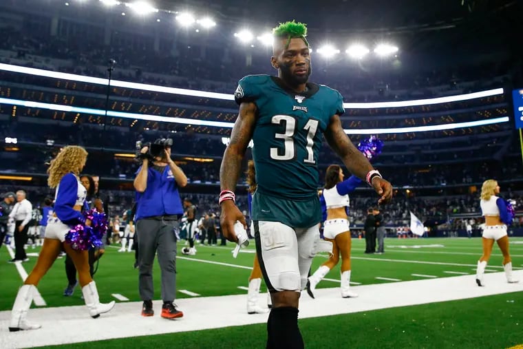Cornerback Jalen Mills walks off the field after the Eagles lost to the the Dallas Cowboys, 37-10, on Sunday in Arlington, Texas.