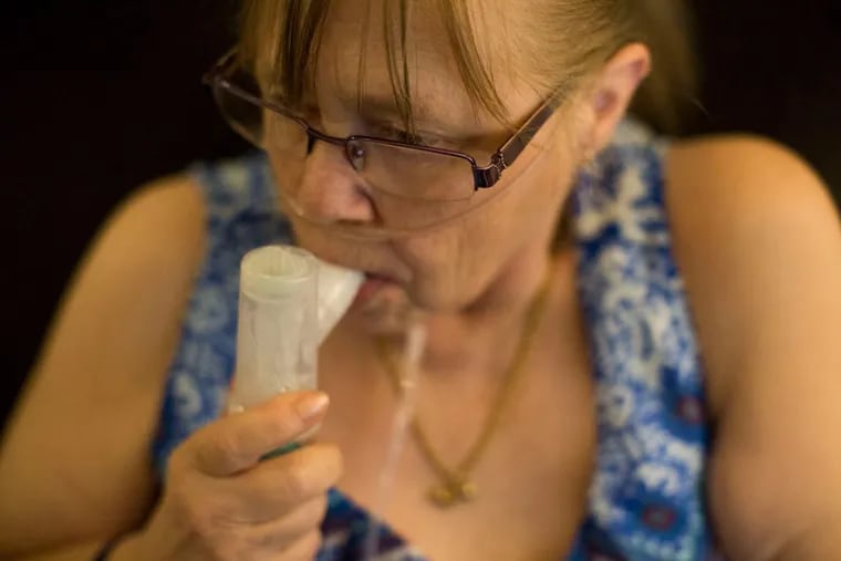 Juanita Milton, who suffers from COPD, uses her nebulizer with albuterol sulfate at her home in Live Oak, Texas, on April 25, 2017. &quot;Having COPD feels like drowning,&quot; Milton said. (Carolyn Van Houten for Kaiser Health News)