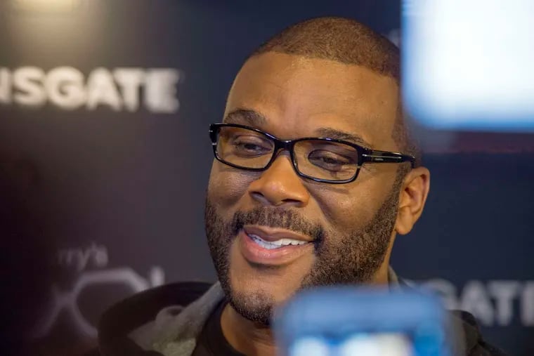 Customers at two suburban Atlanta Walmart stores received a holiday surprise when they found out actor Tyler Perry had paid for their layaway items.