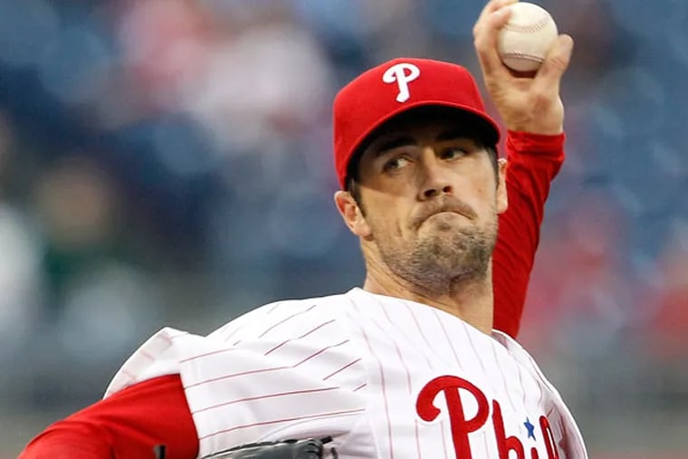 Cole Hamels throws the baseball during the first inning against the St. Louis Cardinals on Thursday, April 18, 2013. (Yong Kim/Staff Photographer)